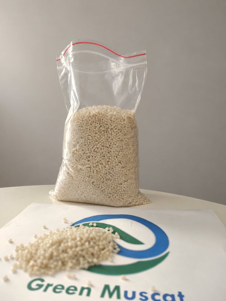 Green Muscat white polymer granule sample in a bag