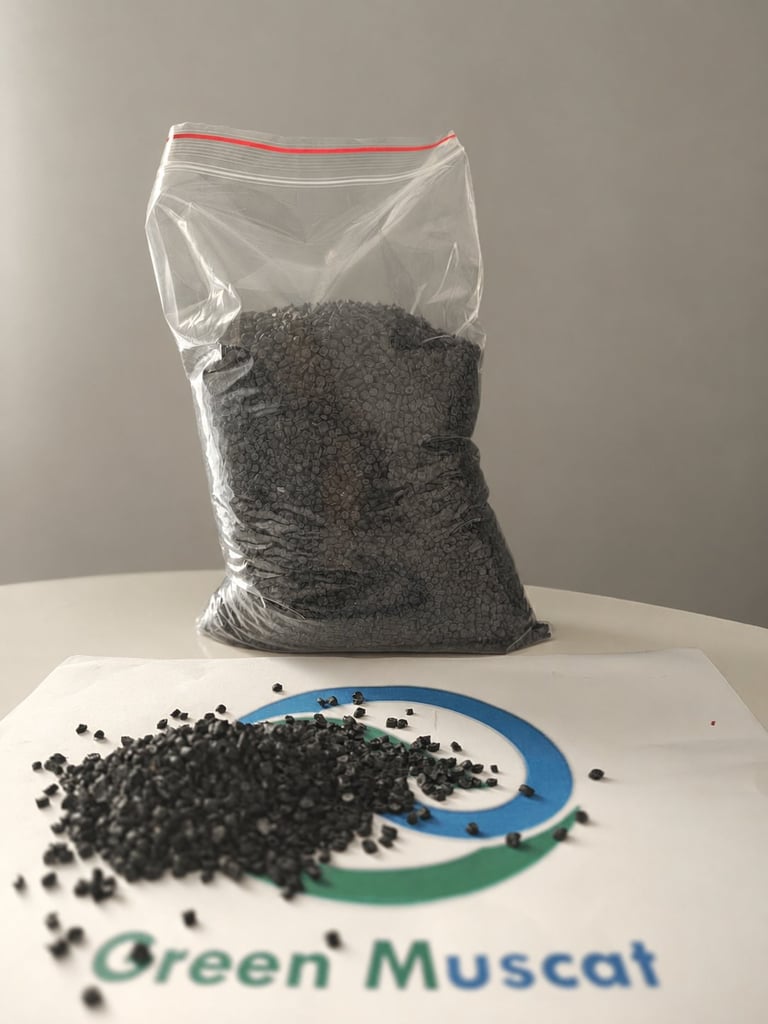 Green Muscat dark polymer granule sample in a bag